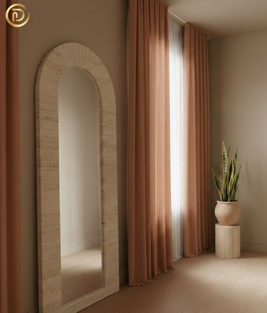 Small room layout featuring vertical terracotta curtains and stone-framed mirror to increase perceived space.